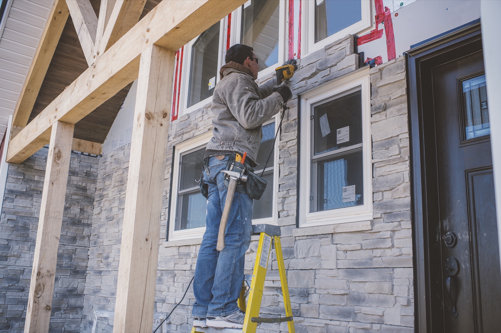 LocalFixx contractor installing exterior siding and trim on a home